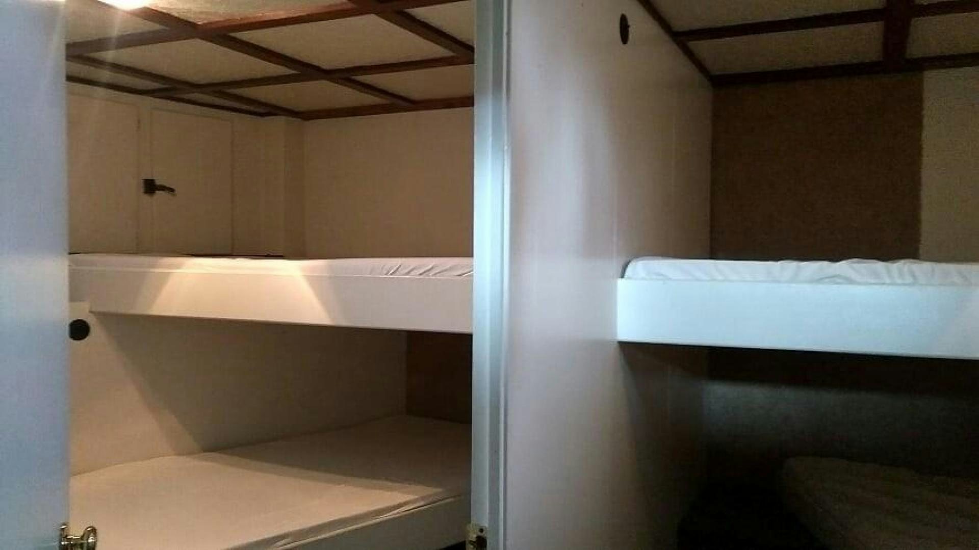 a room with a bathtub and a sink aboard LAURA MARIE Yacht for Sale