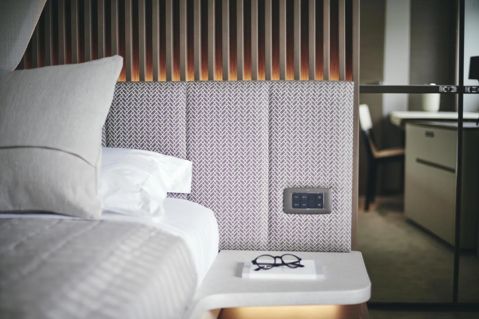 a bed with a white pillow aboard Y85 Yacht for Sale