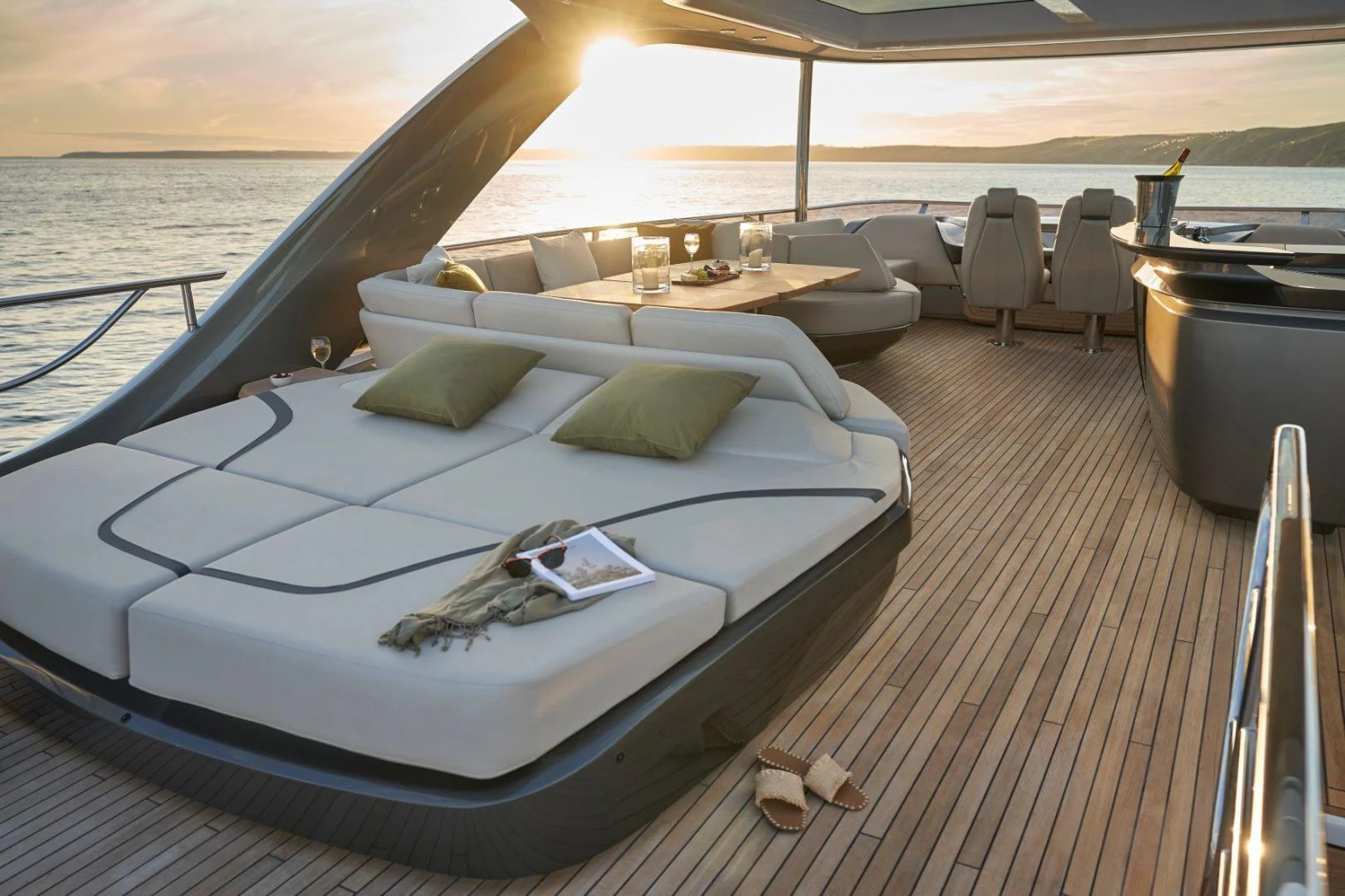 a lounge chair on a deck overlooking a large body of water aboard Y85 Yacht for Sale