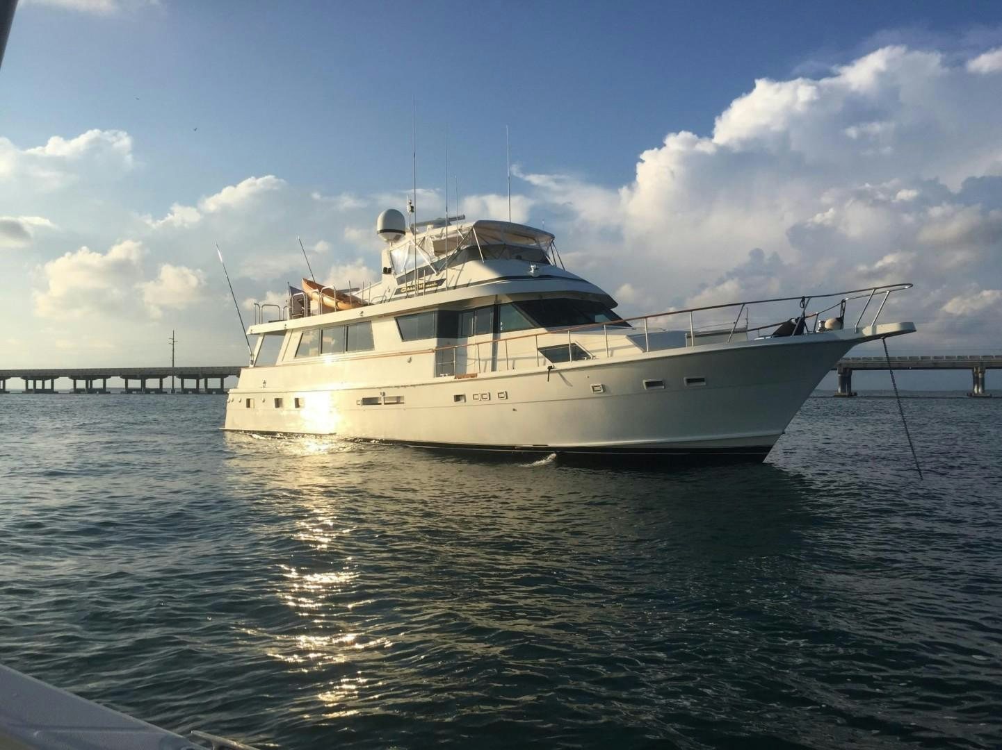 a white boat on the water aboard CATCHIN FEELINGS Yacht for Sale