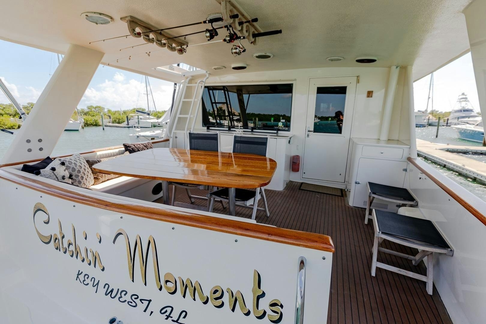 a boat with a table and chairs aboard CATCHIN FEELINGS Yacht for Sale