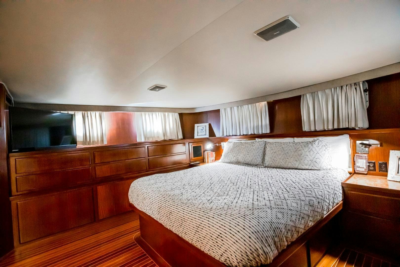 a bed in a room aboard CATCHIN FEELINGS Yacht for Sale