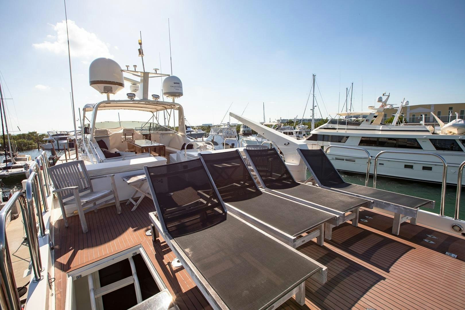 a boat docked at a pier aboard CATCHIN FEELINGS Yacht for Sale