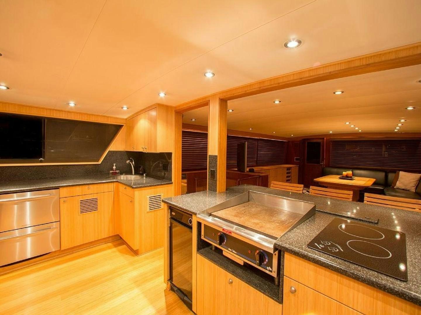 a kitchen with a stove and a microwave aboard CATCHIN FEELINGS Yacht for Sale