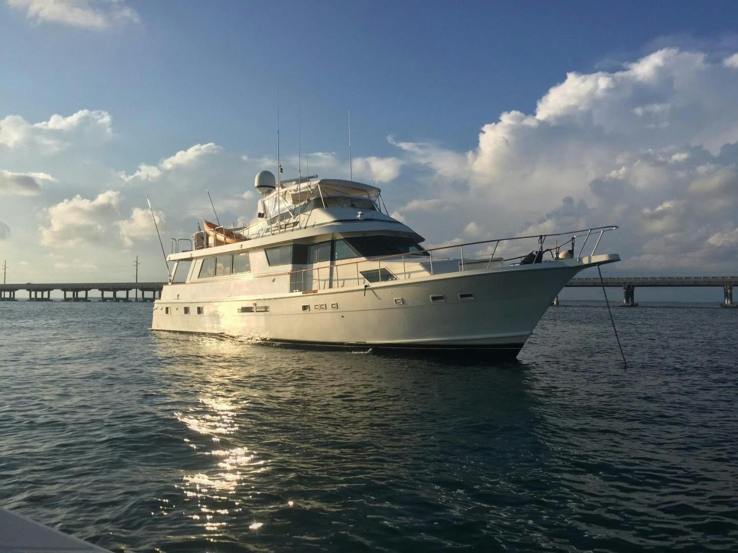 a white boat in the water aboard CATCHIN FEELINGS Yacht for Sale