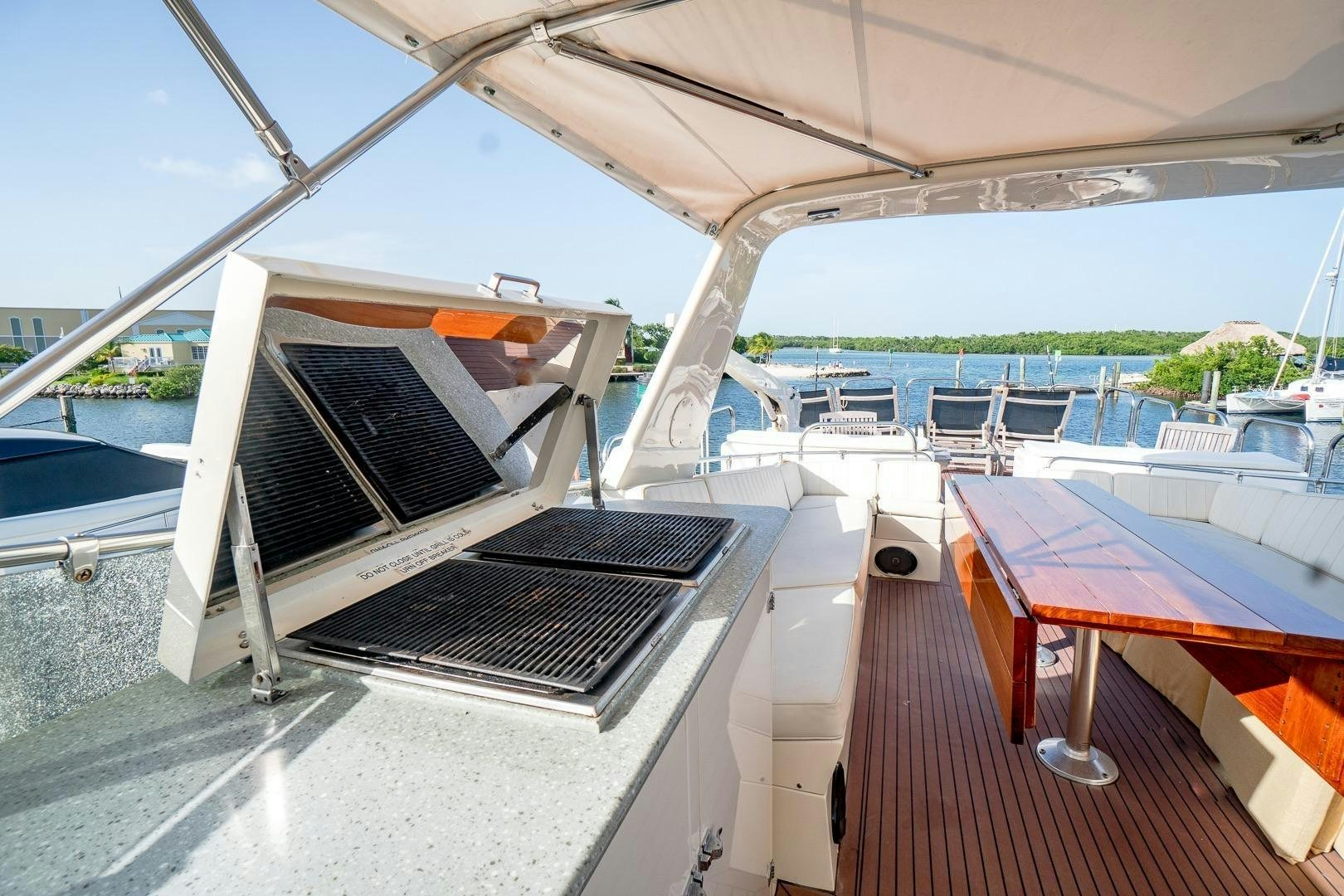 a deck with a barbecue grill aboard CATCHIN FEELINGS Yacht for Sale