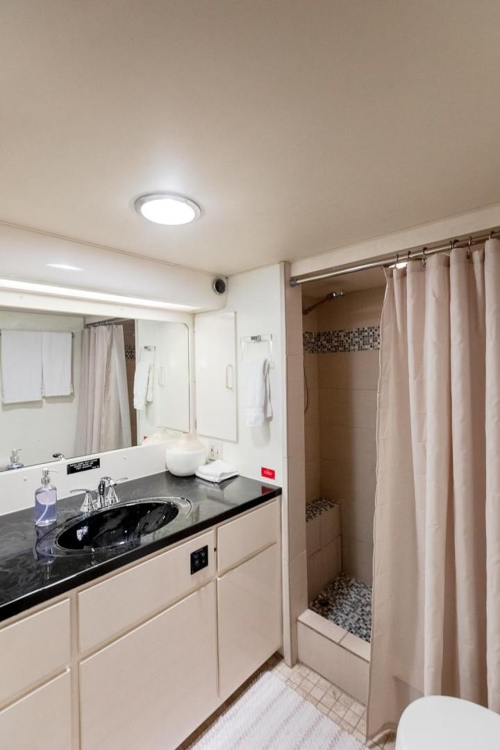 a bathroom with a sink and a shower aboard CATCHIN FEELINGS Yacht for Sale