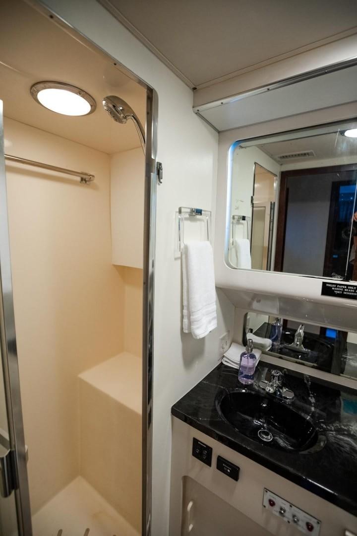 a bathroom with a sink and a mirror aboard CATCHIN FEELINGS Yacht for Sale