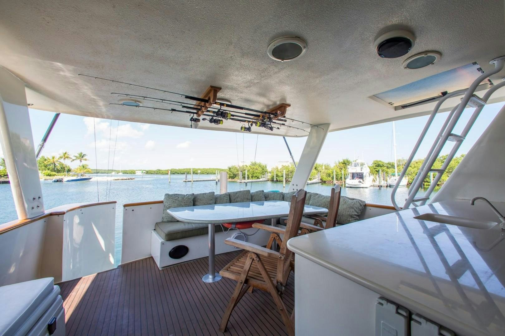 a room with a table and chairs aboard CATCHIN FEELINGS Yacht for Sale
