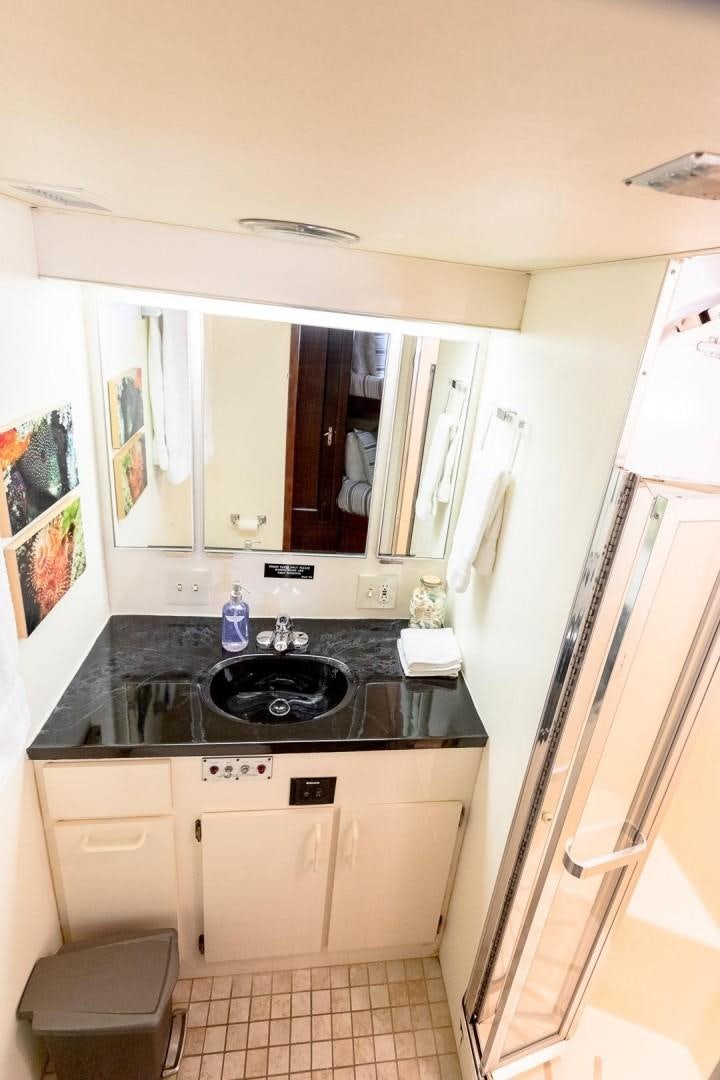 a kitchen with a black stove aboard CATCHIN FEELINGS Yacht for Sale