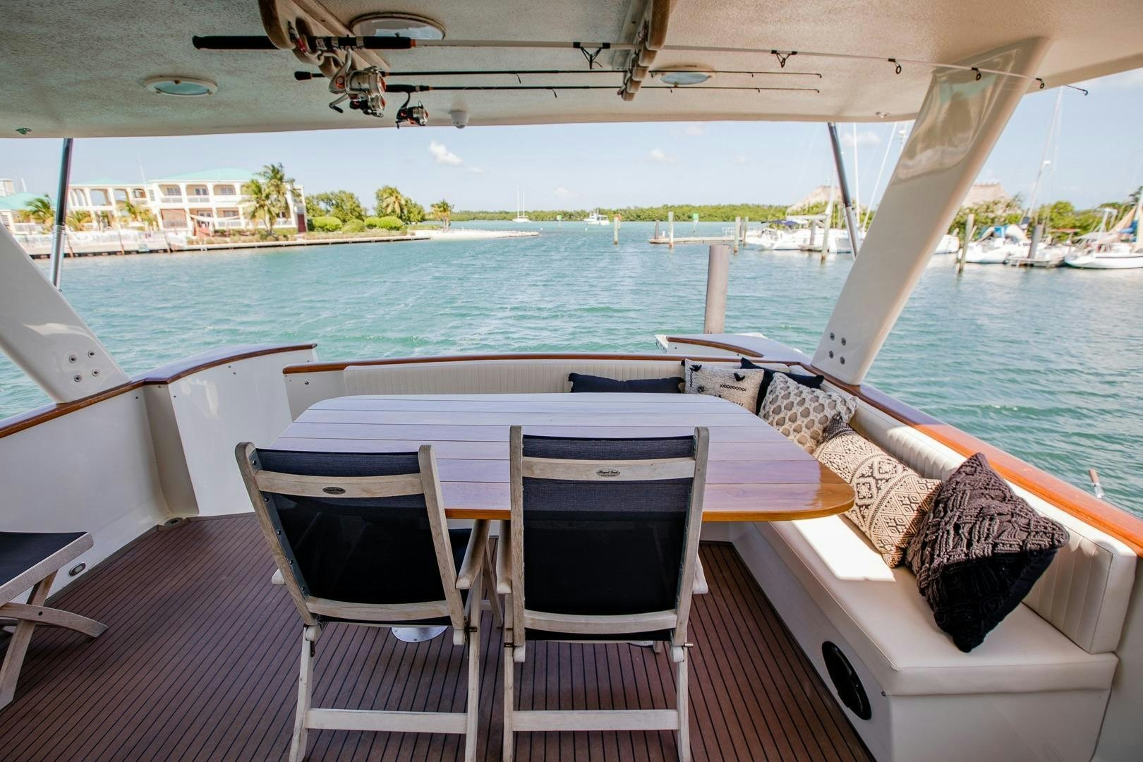 a table and chairs on a boat aboard CATCHIN FEELINGS Yacht for Sale