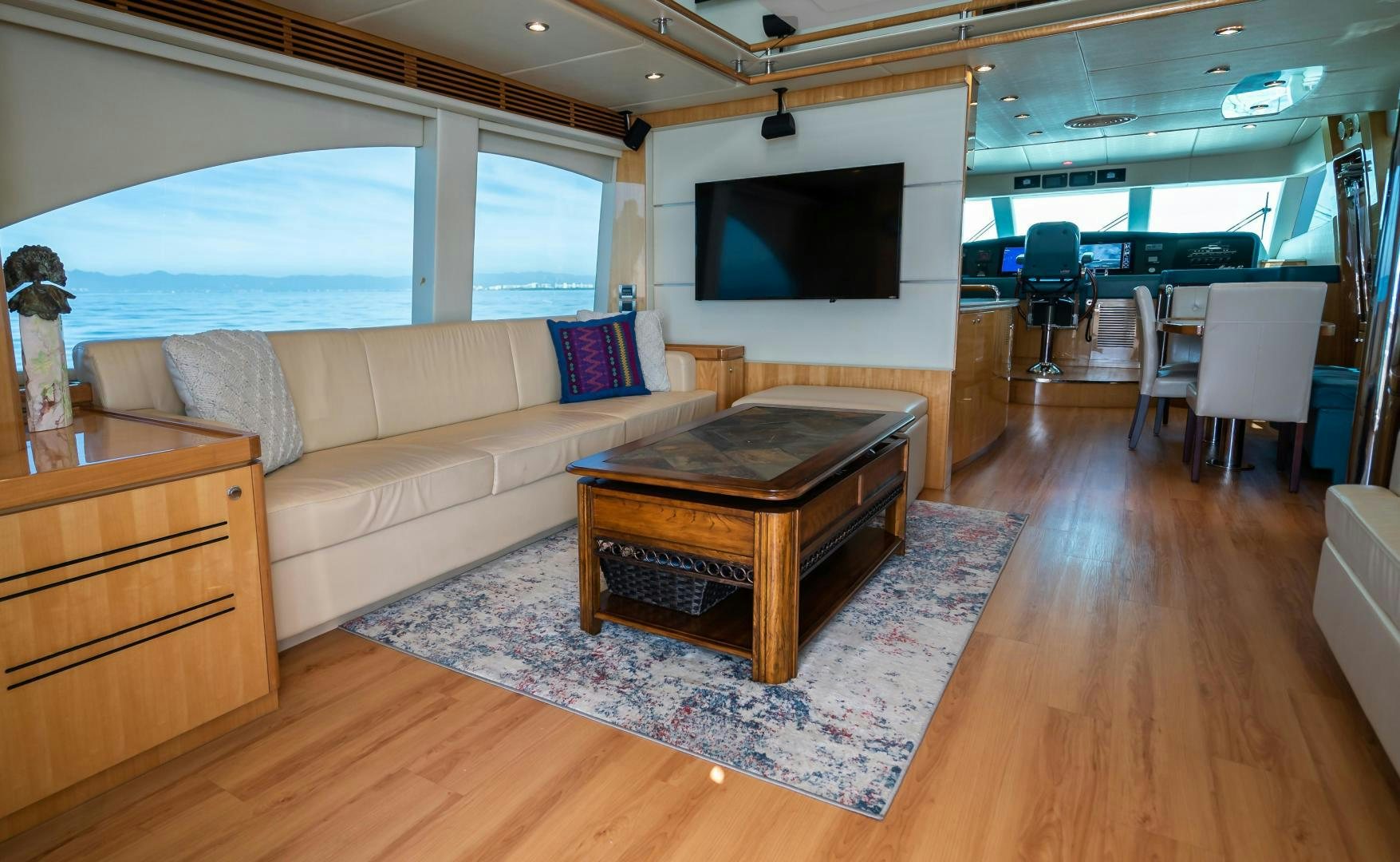 a living room with a couch and a tv aboard FULL HOUSE Yacht for Sale