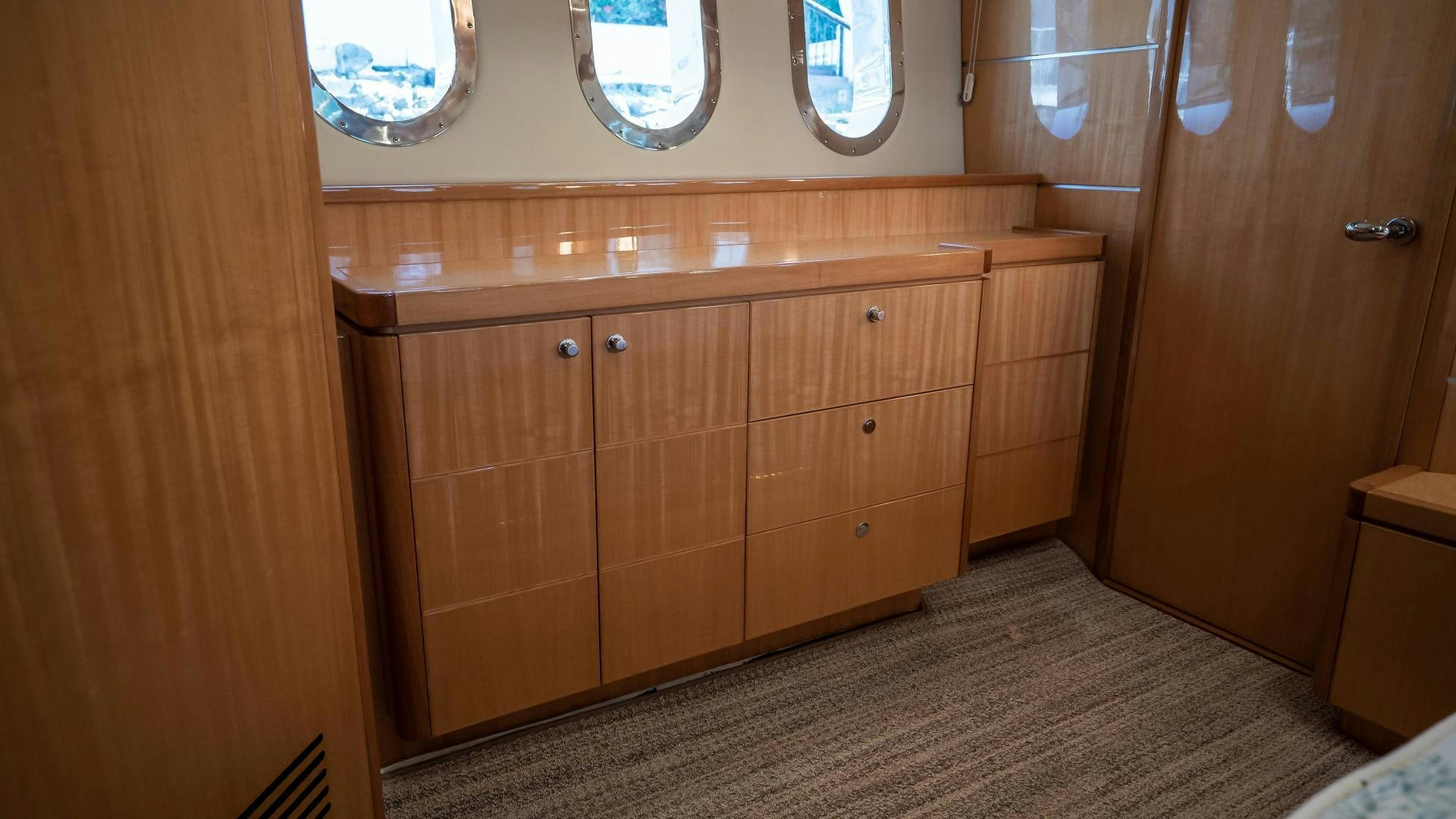a room with wooden cabinets aboard FULL HOUSE Yacht for Sale