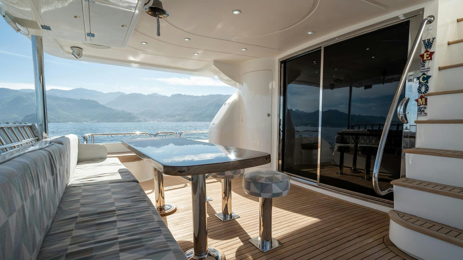 a room with a table and chairs aboard FULL HOUSE Yacht for Sale