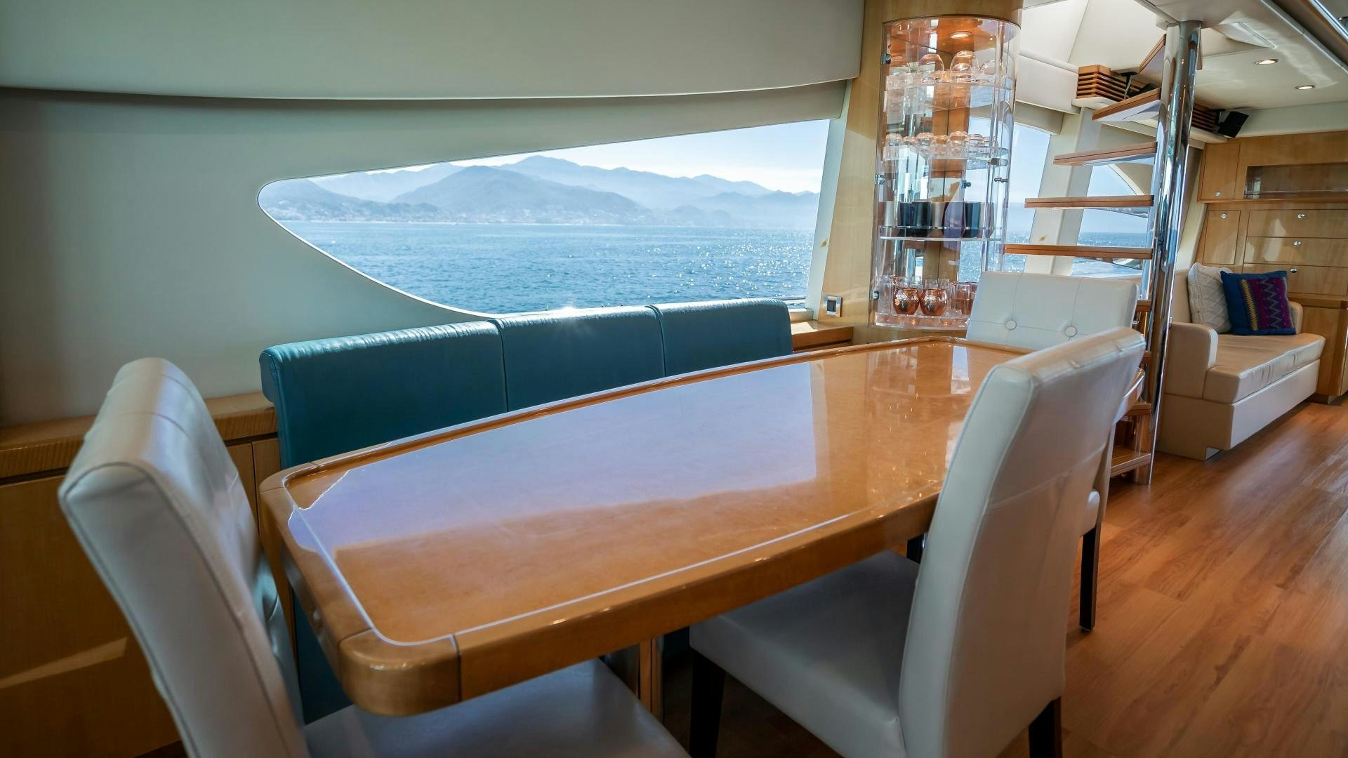 a room with a table and chairs aboard FULL HOUSE Yacht for Sale