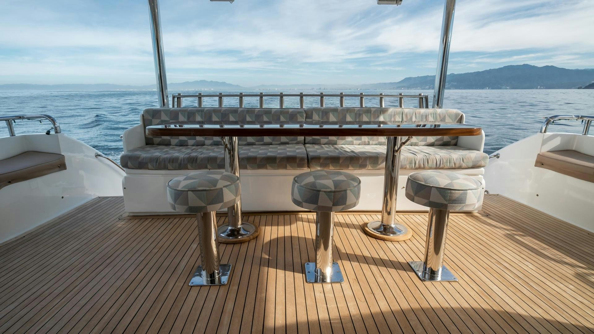 a table on a deck aboard FULL HOUSE Yacht for Sale