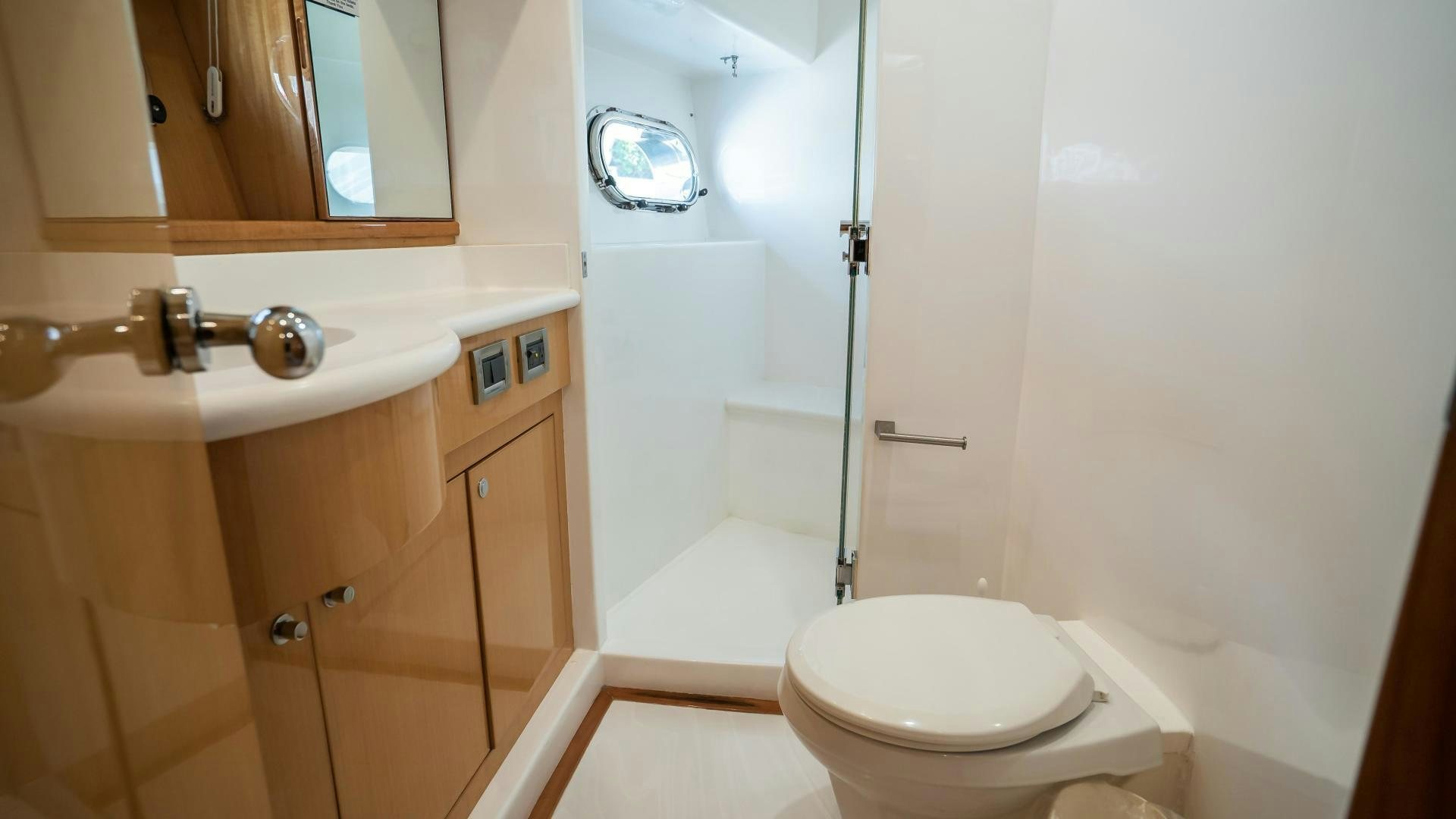 a bathroom with a glass shower aboard FULL HOUSE Yacht for Sale