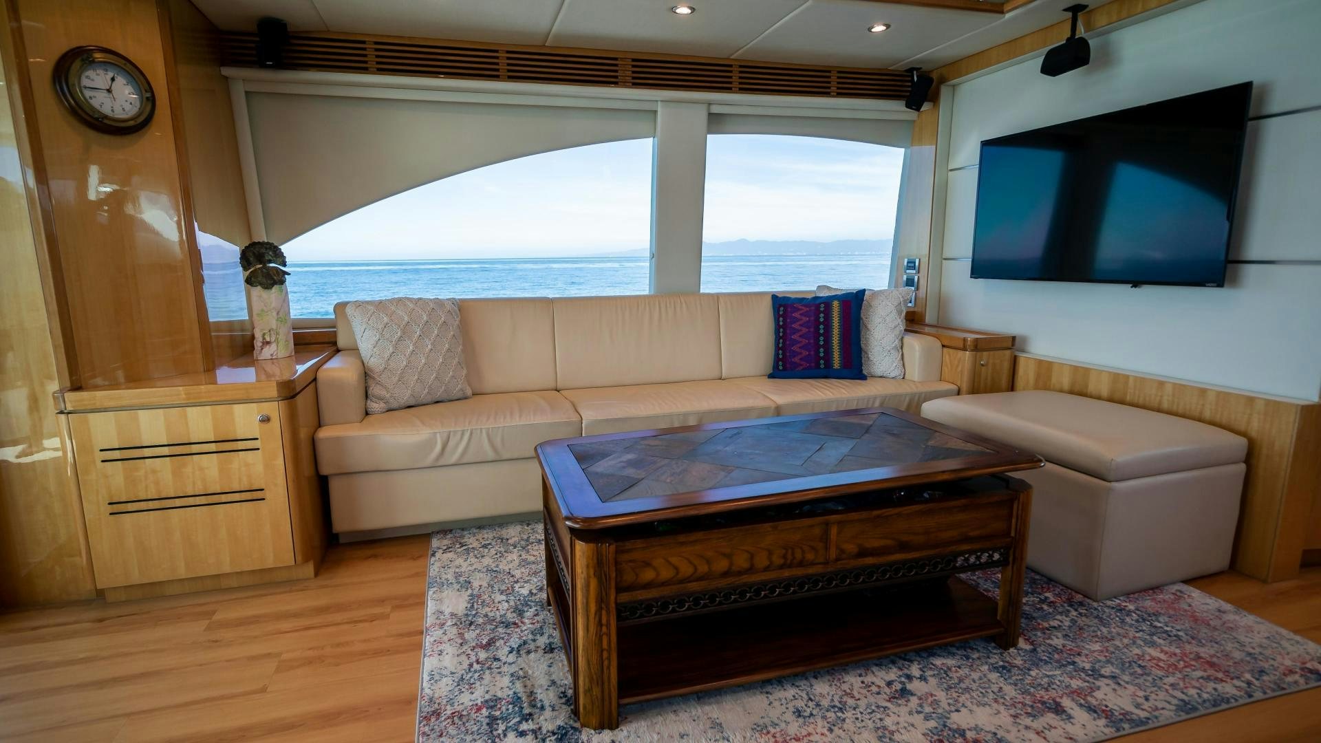 a living room with a large window aboard FULL HOUSE Yacht for Sale