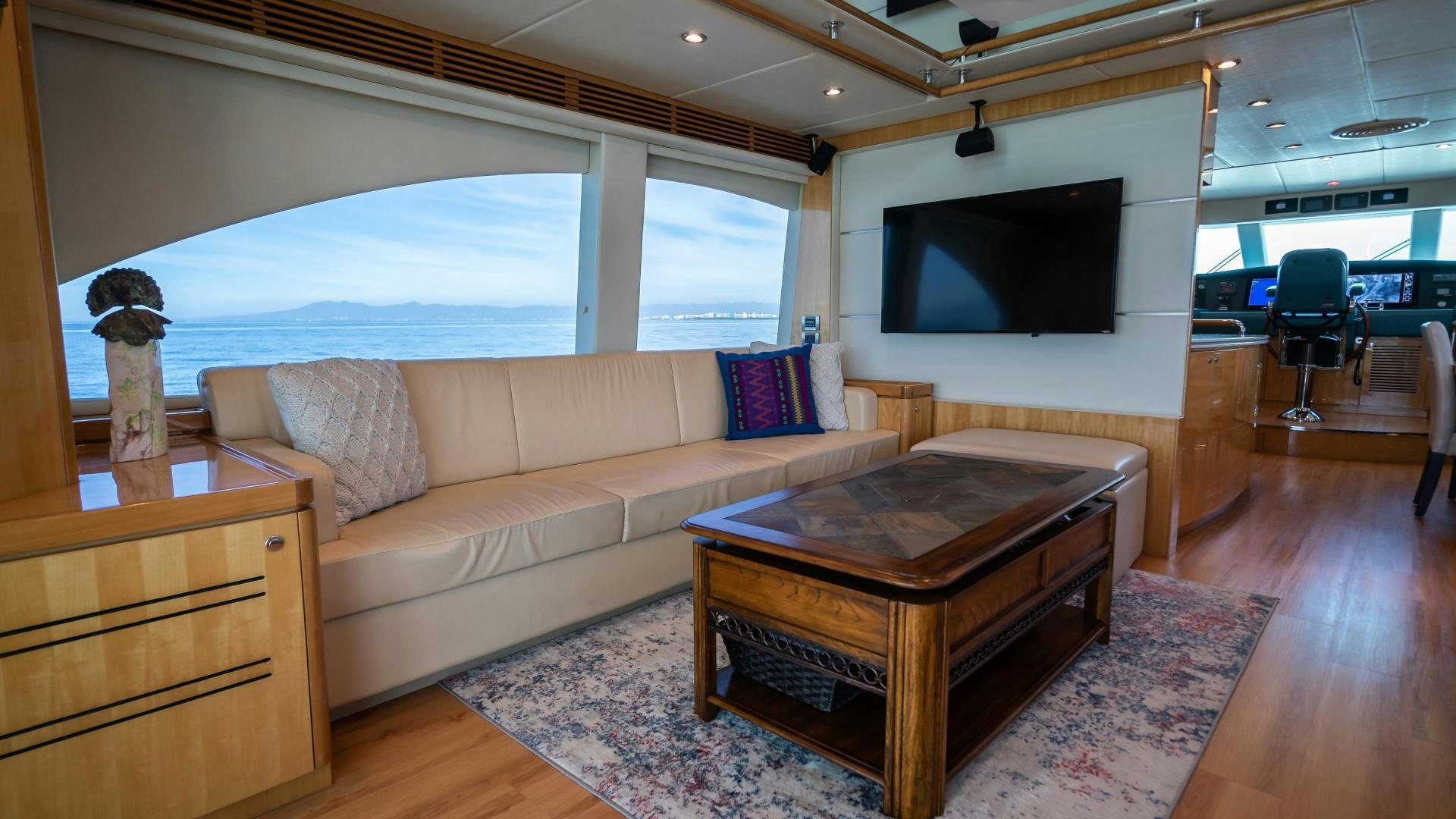 a living room with a couch and a television aboard FULL HOUSE Yacht for Sale