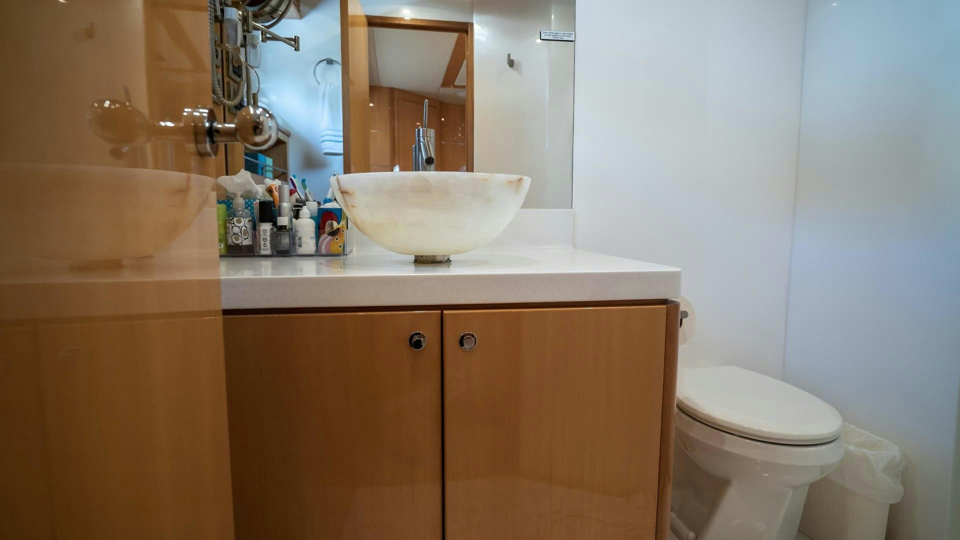 a bathroom with a sink and toilet aboard FULL HOUSE Yacht for Sale