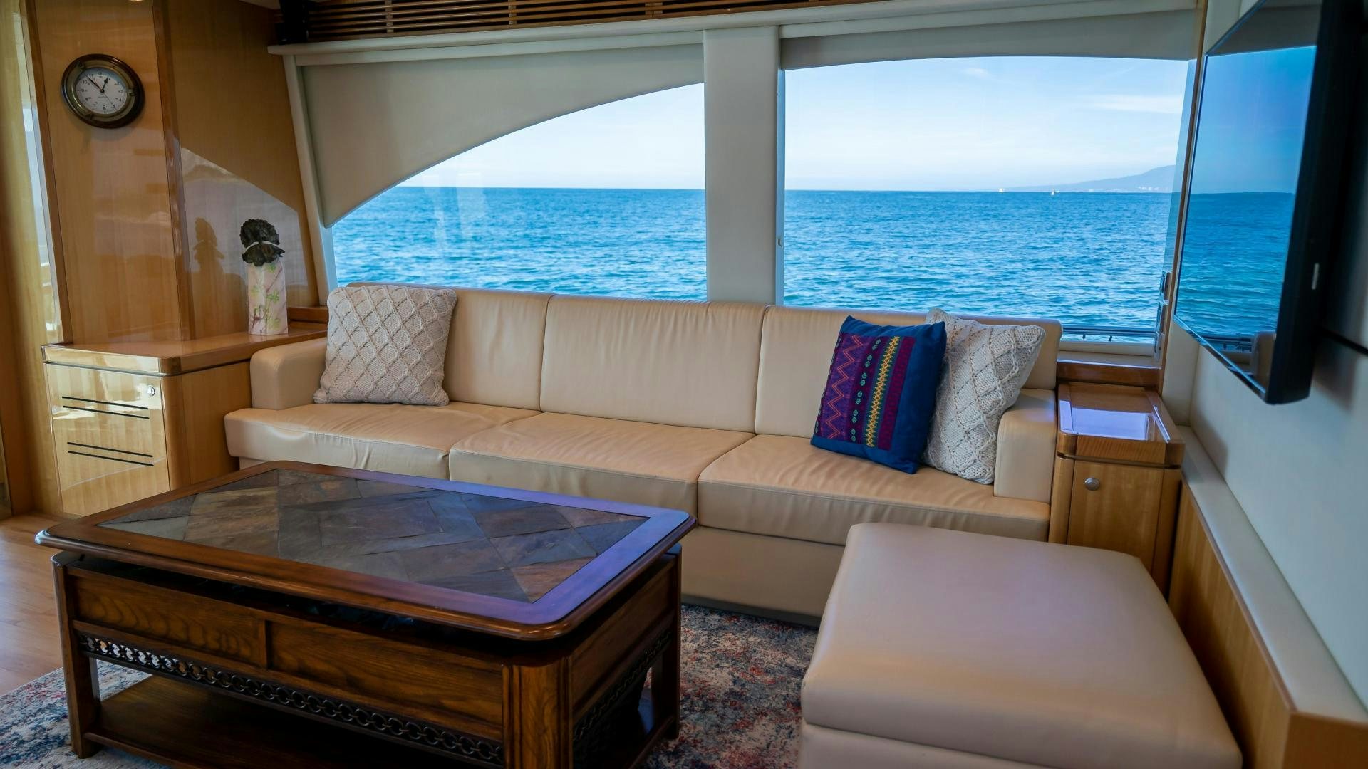 a living room with a large window aboard FULL HOUSE Yacht for Sale