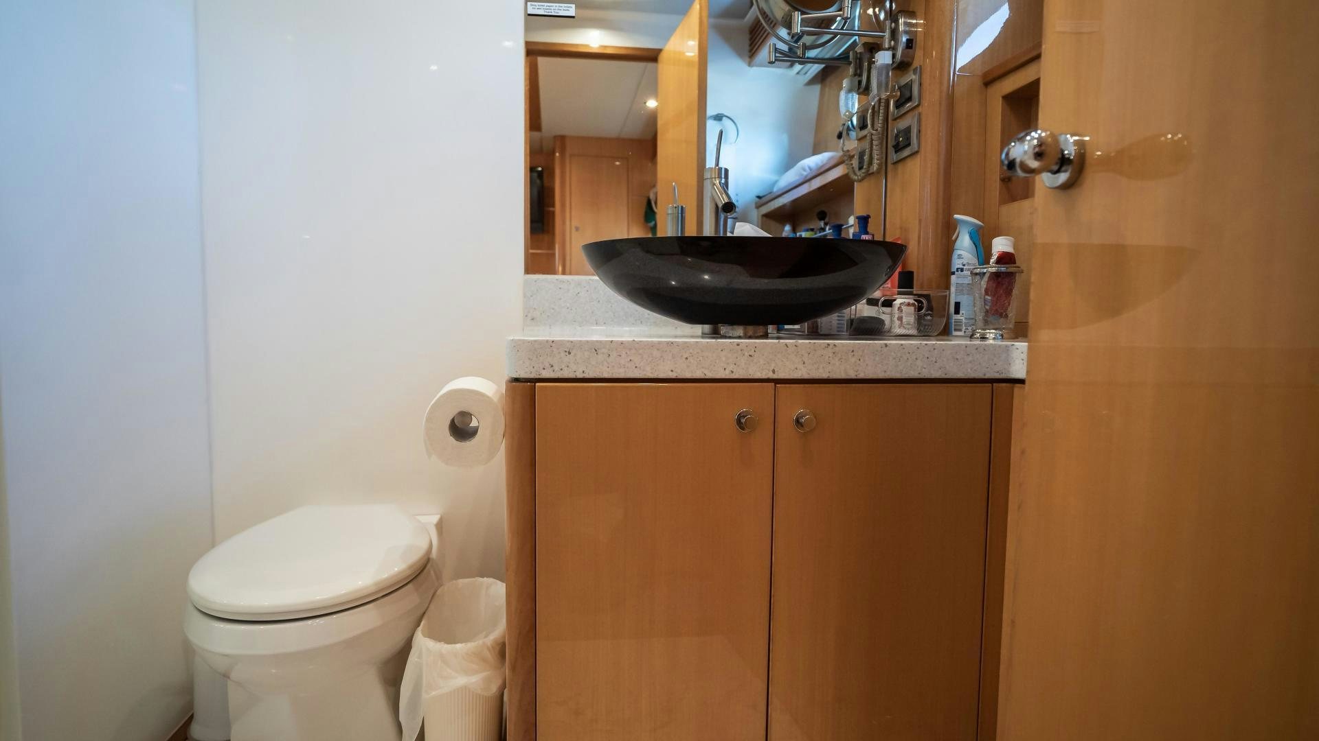 a bathroom with a sink and toilet aboard FULL HOUSE Yacht for Sale