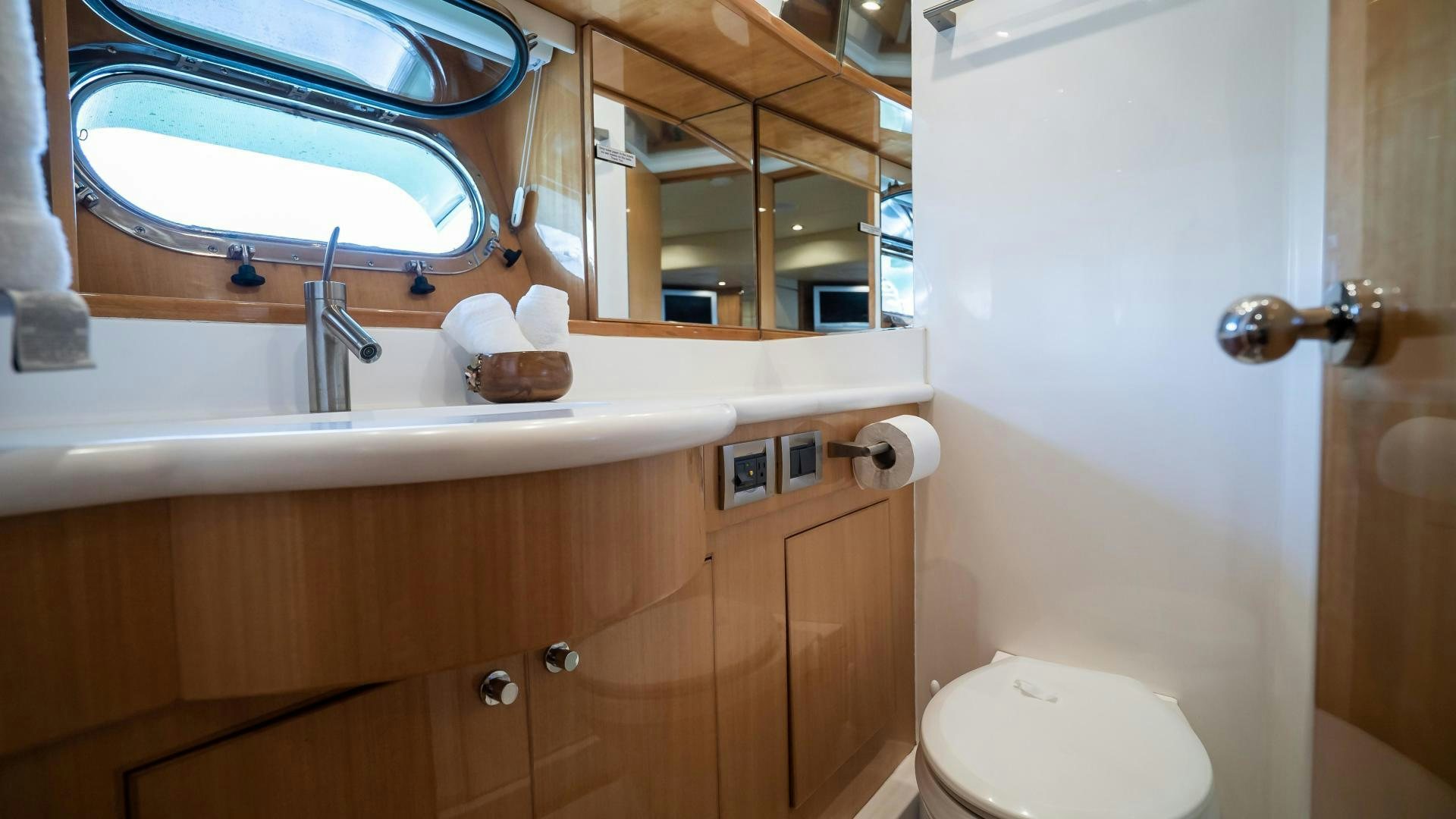 a bathroom with a toilet and a sink aboard FULL HOUSE Yacht for Sale
