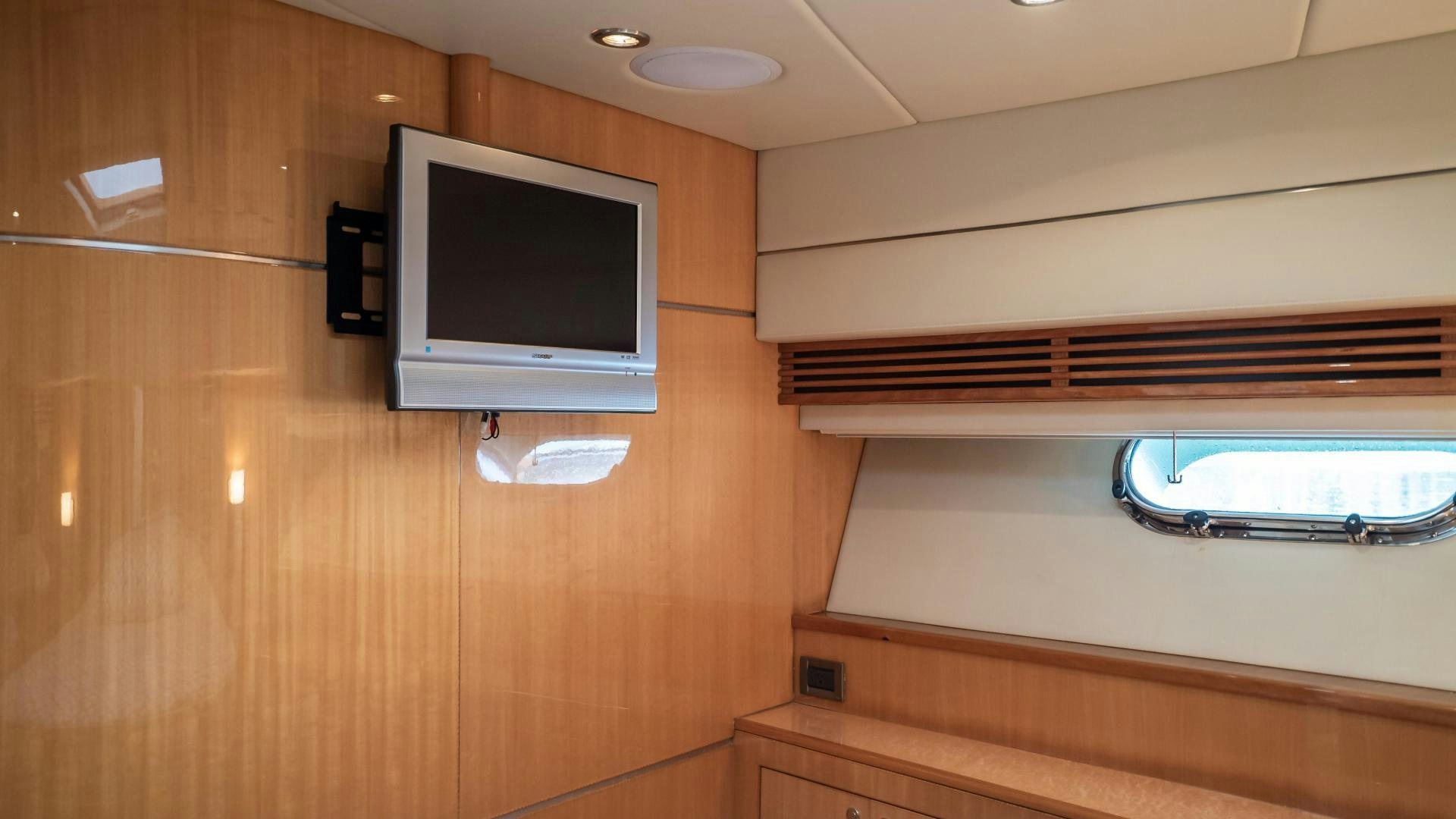 a tv on a cabinet aboard FULL HOUSE Yacht for Sale