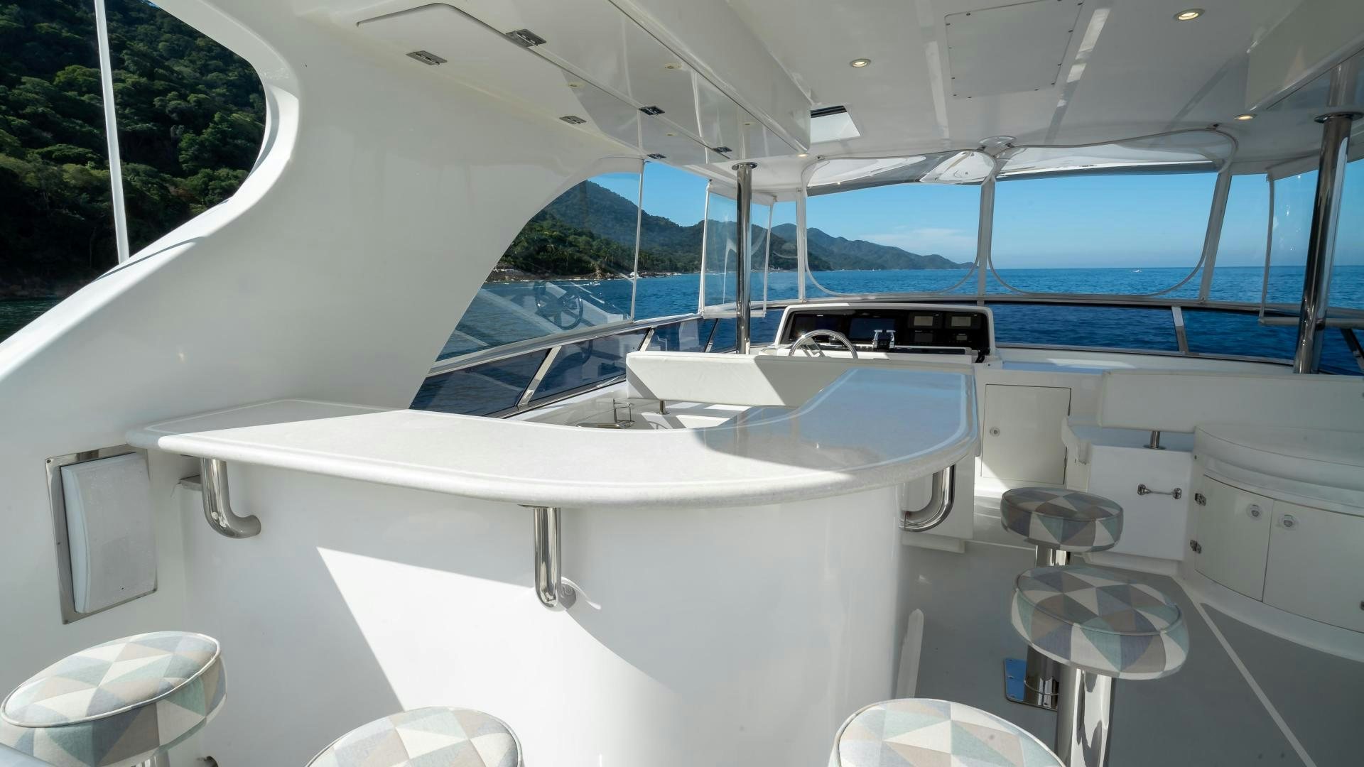 a white boat in a large room aboard FULL HOUSE Yacht for Sale
