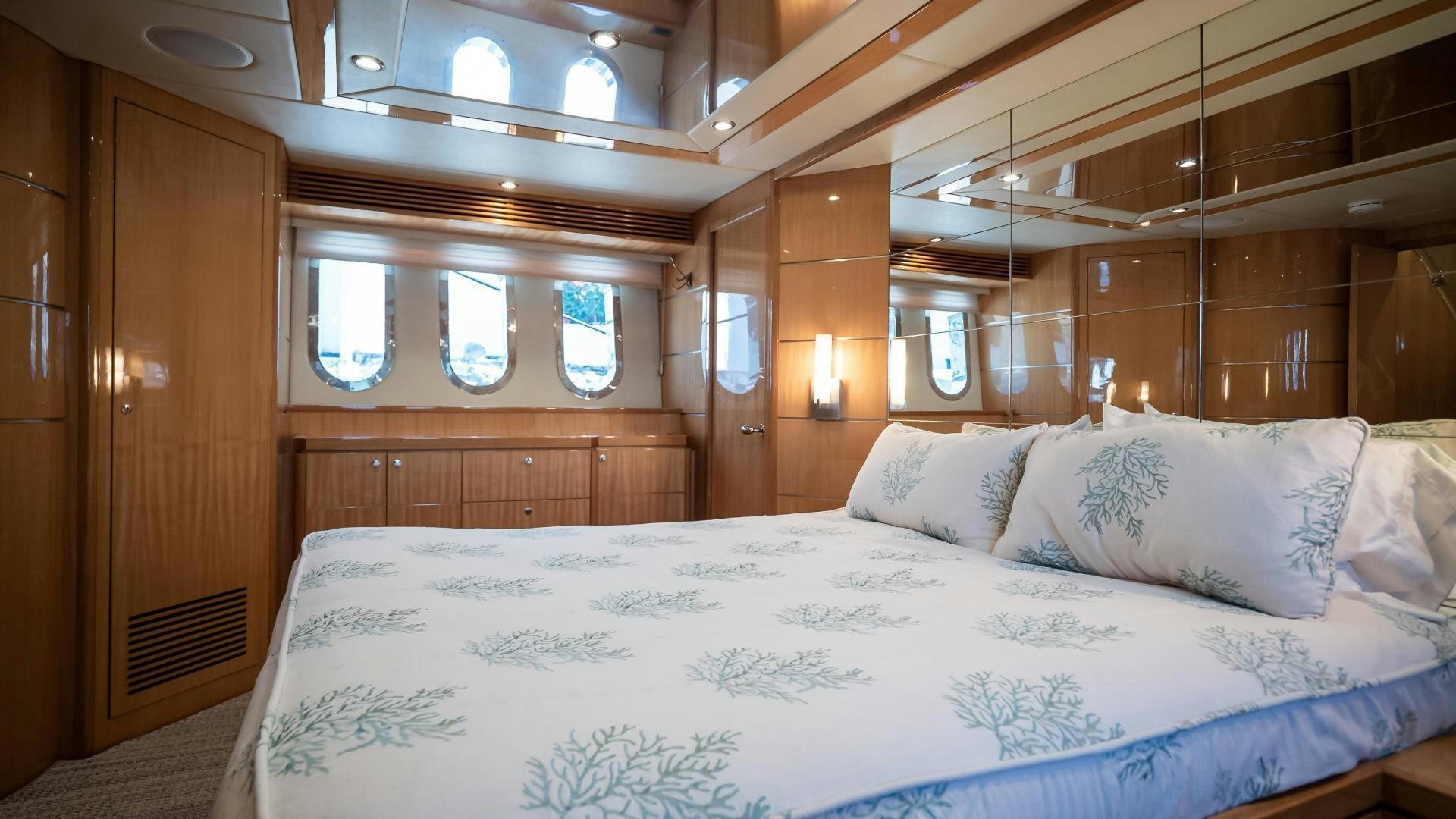 a bed with white sheets aboard FULL HOUSE Yacht for Sale