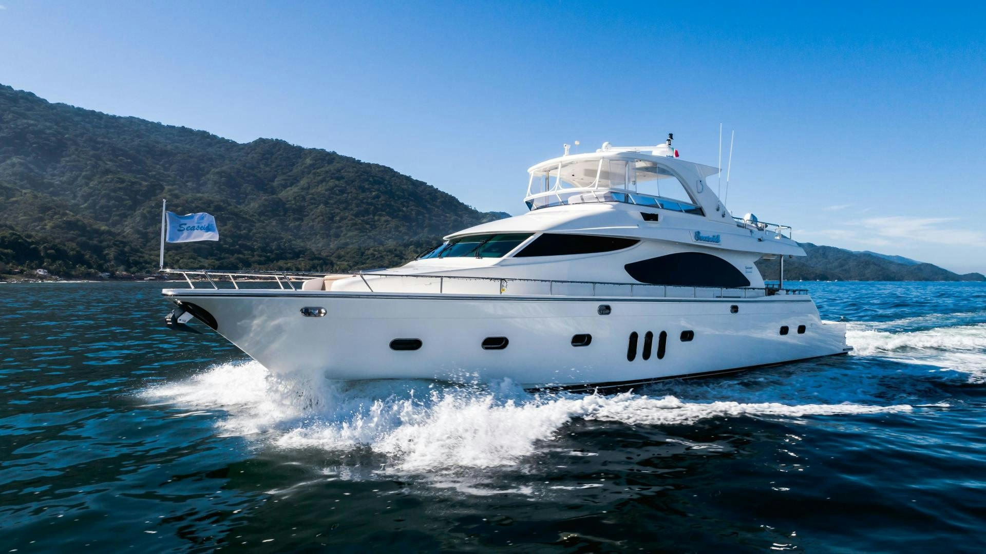 a white yacht on the water aboard FULL HOUSE Yacht for Sale