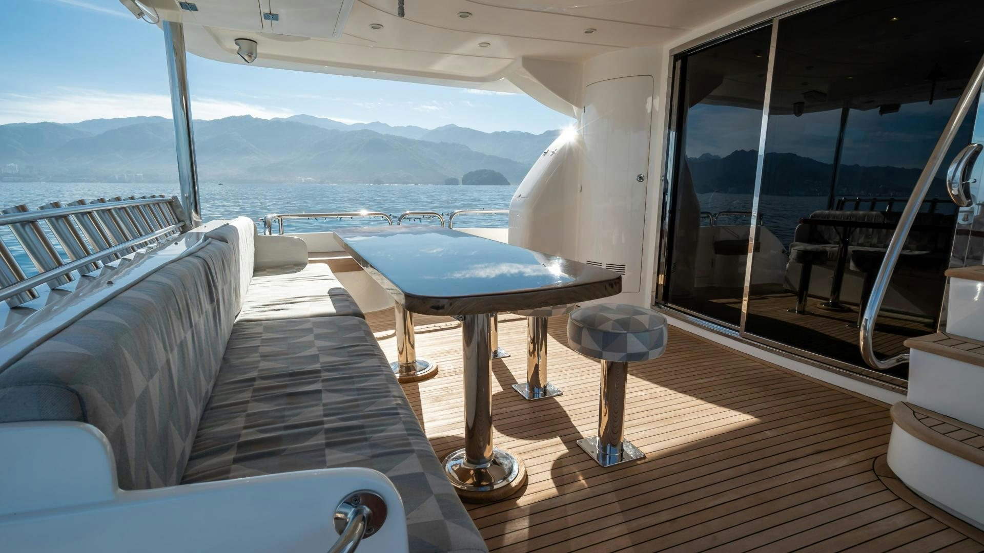 a room with a table and chairs aboard FULL HOUSE Yacht for Sale