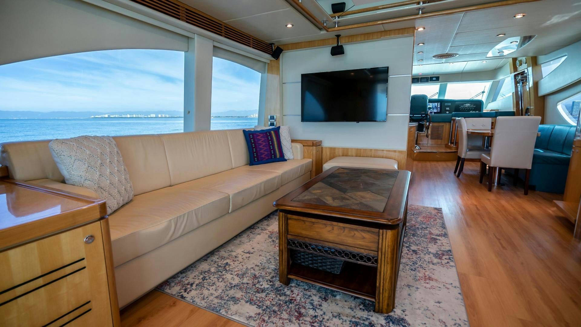 a living room with a couch and a tv aboard FULL HOUSE Yacht for Sale