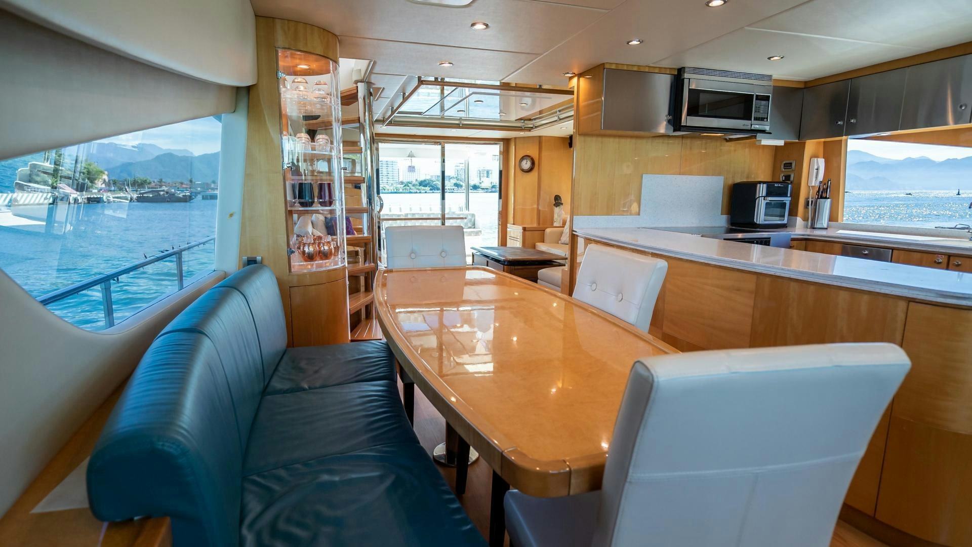 a room with a table and chairs aboard FULL HOUSE Yacht for Sale