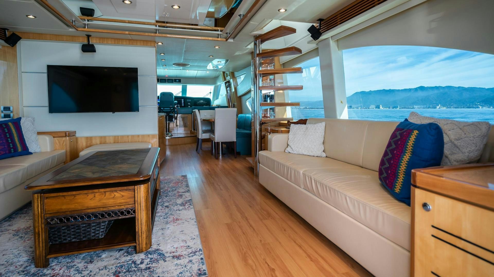 a room with a couch and a television aboard FULL HOUSE Yacht for Sale