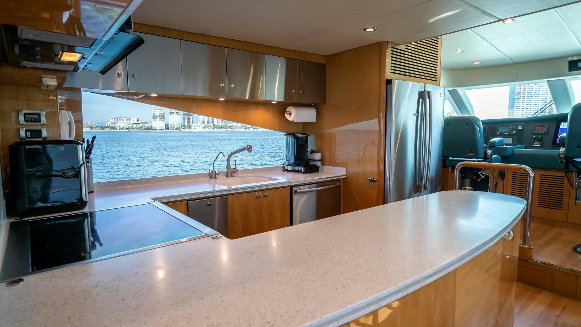 a large kitchen with a large island aboard FULL HOUSE Yacht for Sale