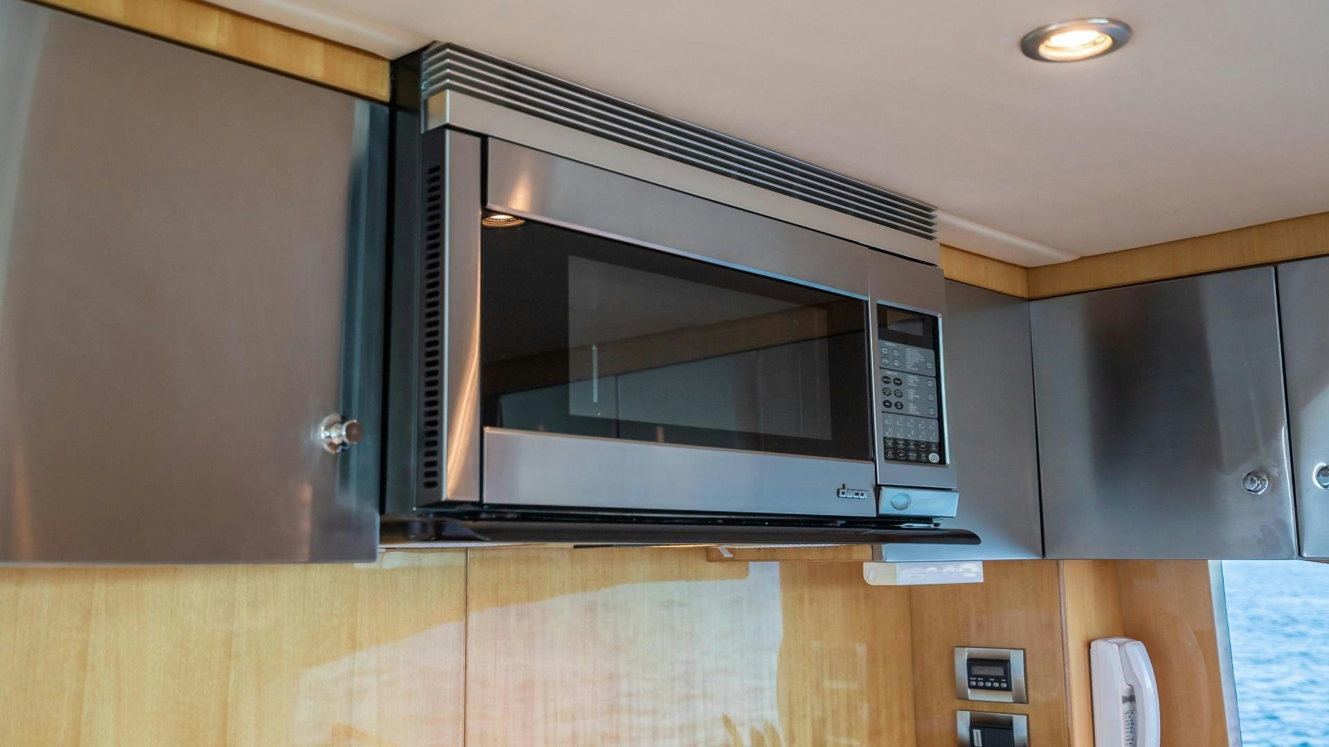 a microwave oven in a kitchen aboard FULL HOUSE Yacht for Sale