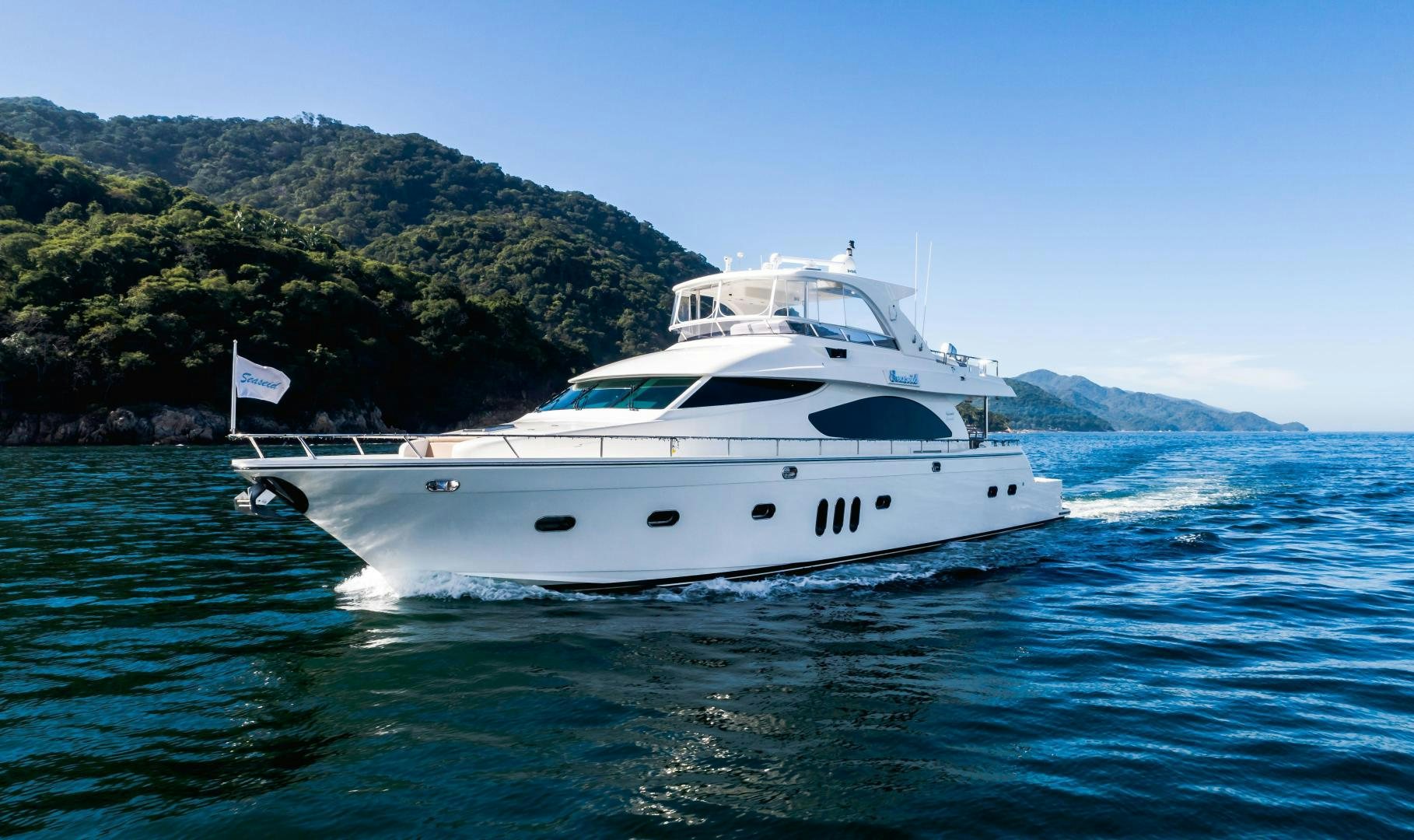 a white yacht on the water aboard FULL HOUSE Yacht for Sale