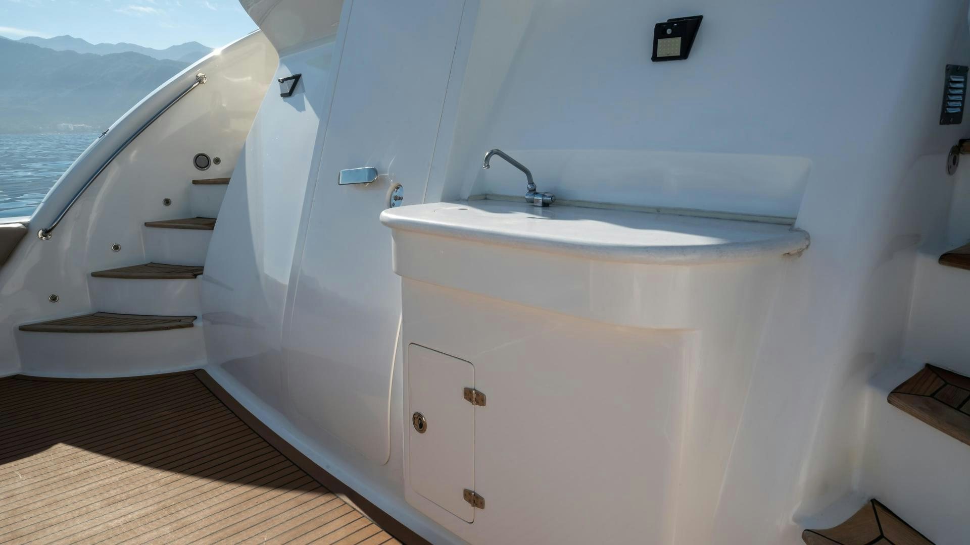 a bathroom with a tub sink and toilet aboard FULL HOUSE Yacht for Sale