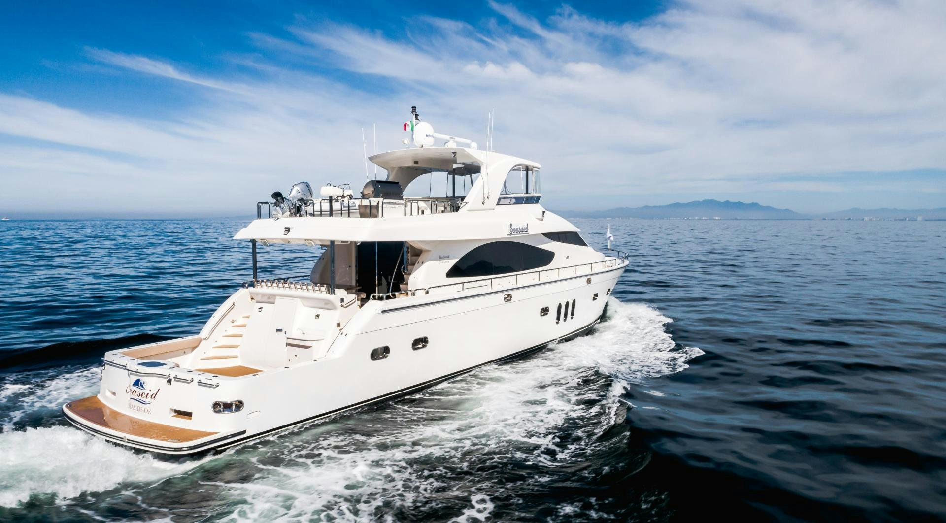a white yacht in the water aboard FULL HOUSE Yacht for Sale