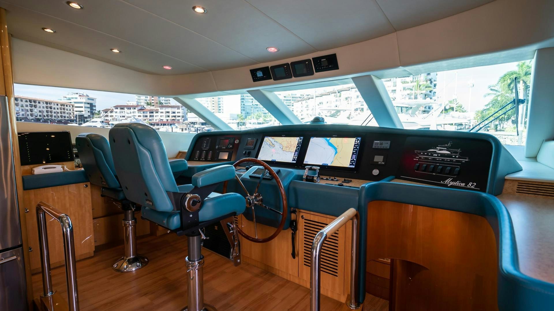 a room with chairs and tables aboard FULL HOUSE Yacht for Sale