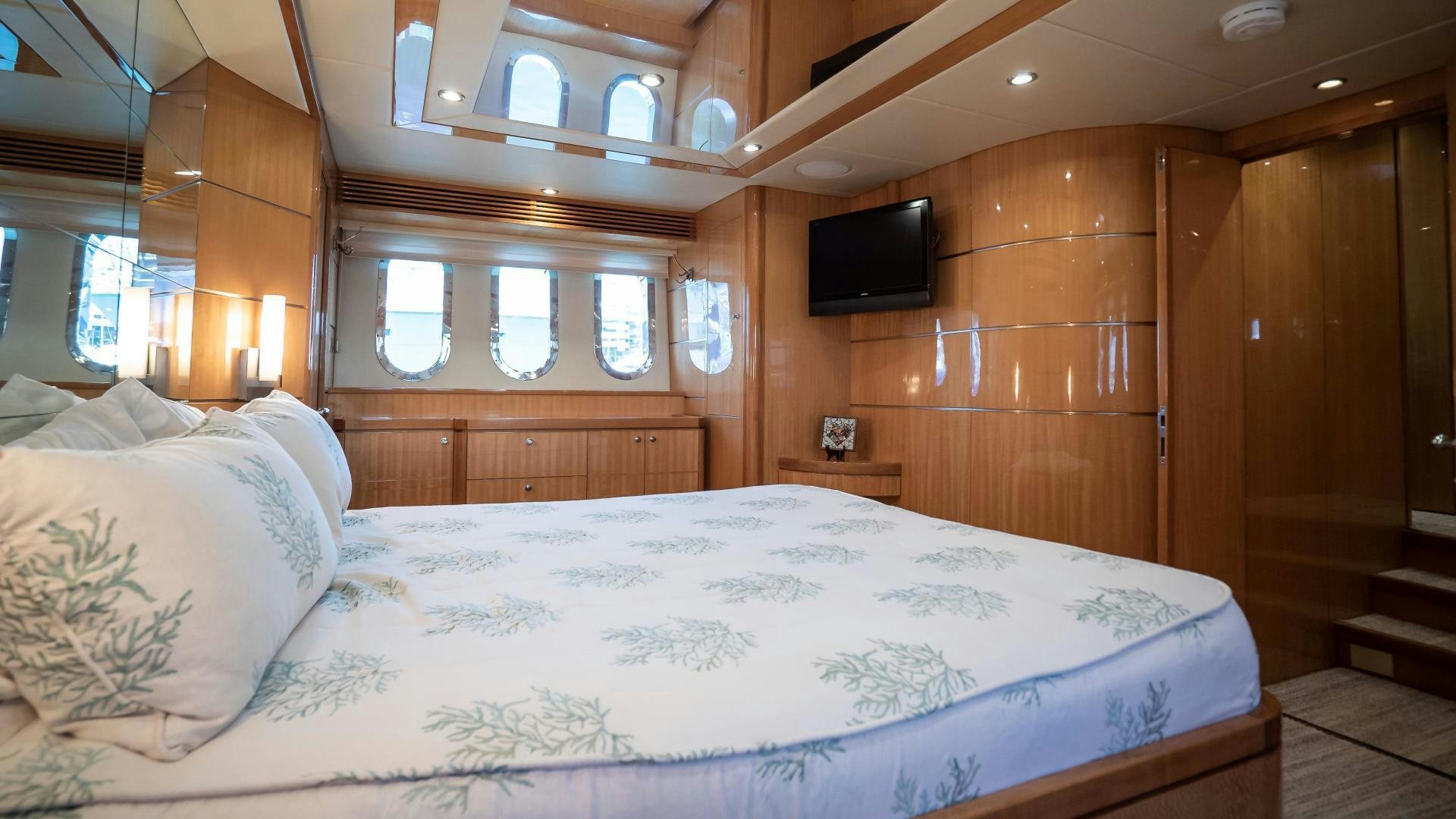 a bed with a white sheet aboard FULL HOUSE Yacht for Sale