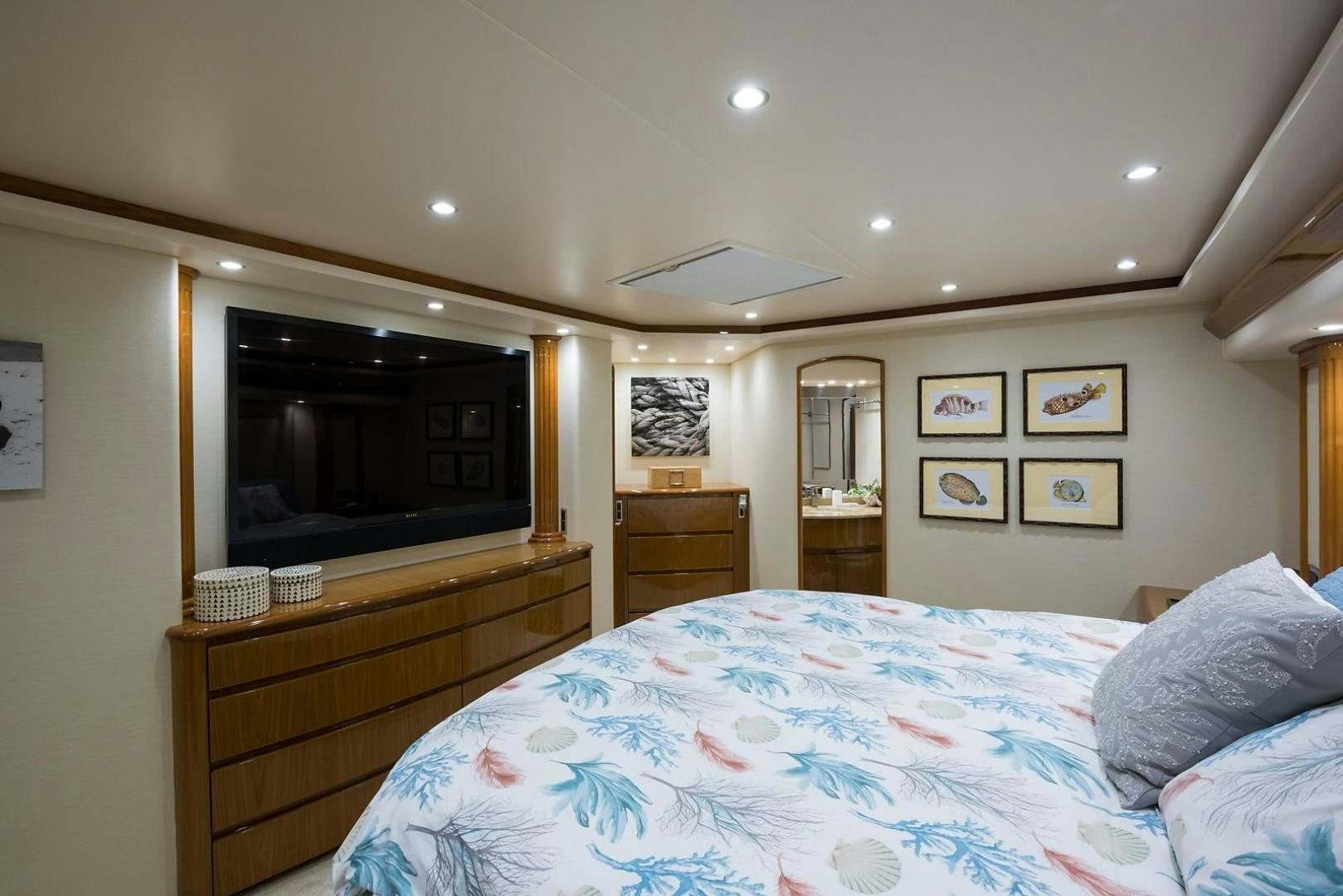 a bedroom with a bed and a television aboard NO NAME 82 Yacht for Sale
