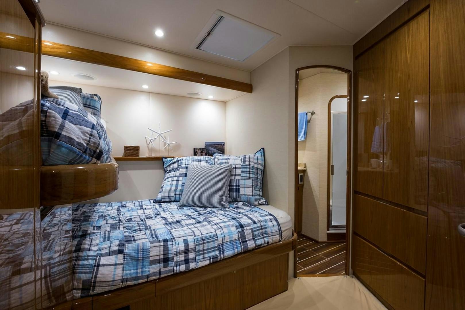 a bedroom with a bed and a closet aboard NO NAME 82 Yacht for Sale