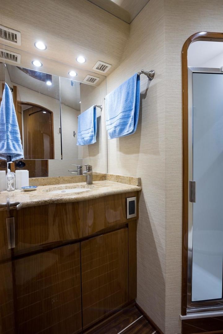 a bathroom with a sink and a mirror aboard NO NAME 82 Yacht for Sale