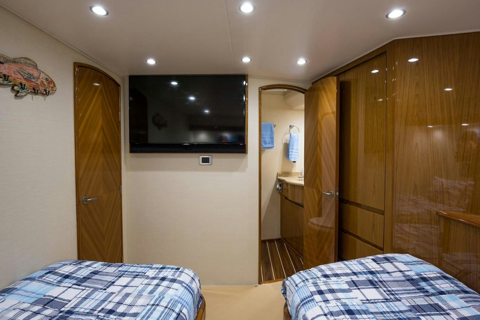 a bedroom with a bed and a television aboard NO NAME 82 Yacht for Sale