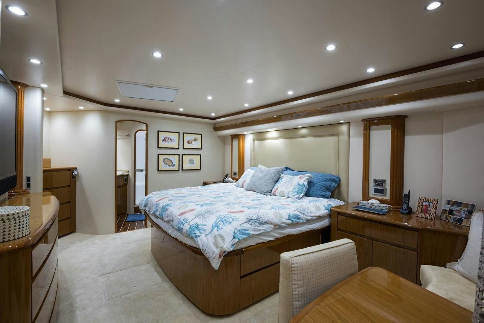 a bedroom with a bed and a desk aboard NO NAME 82 Yacht for Sale