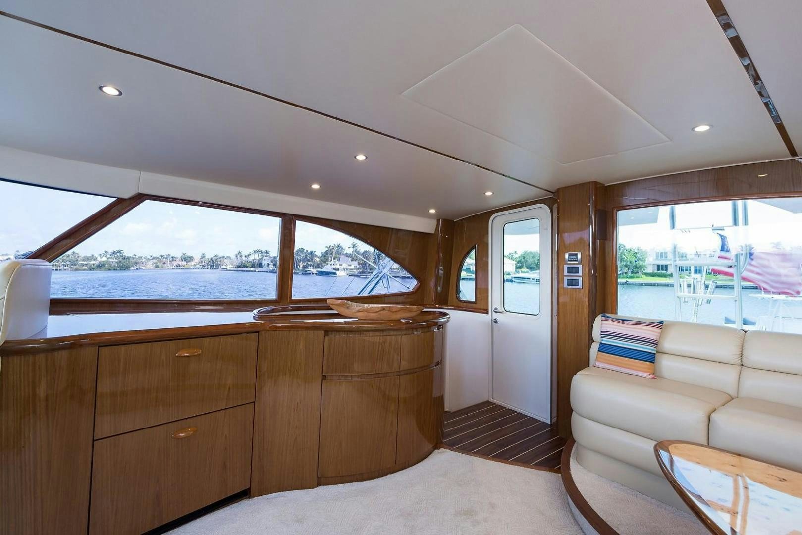 a living room with a couch and a large window aboard NO NAME 82 Yacht for Sale