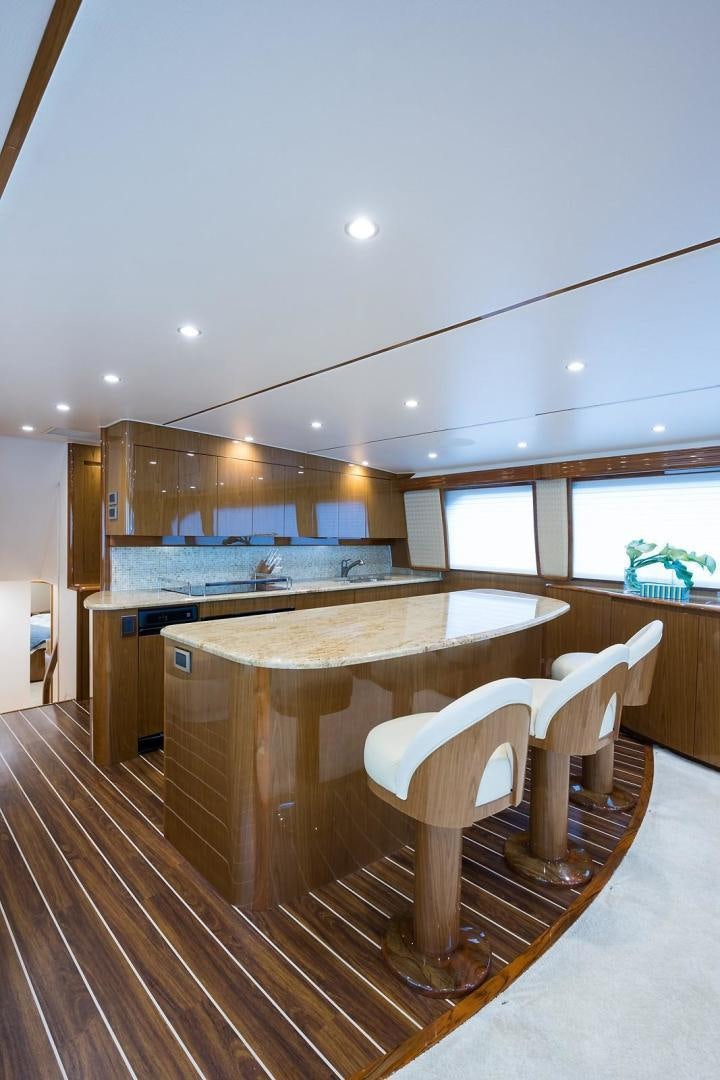 a kitchen with a table and chairs aboard NO NAME 82 Yacht for Sale