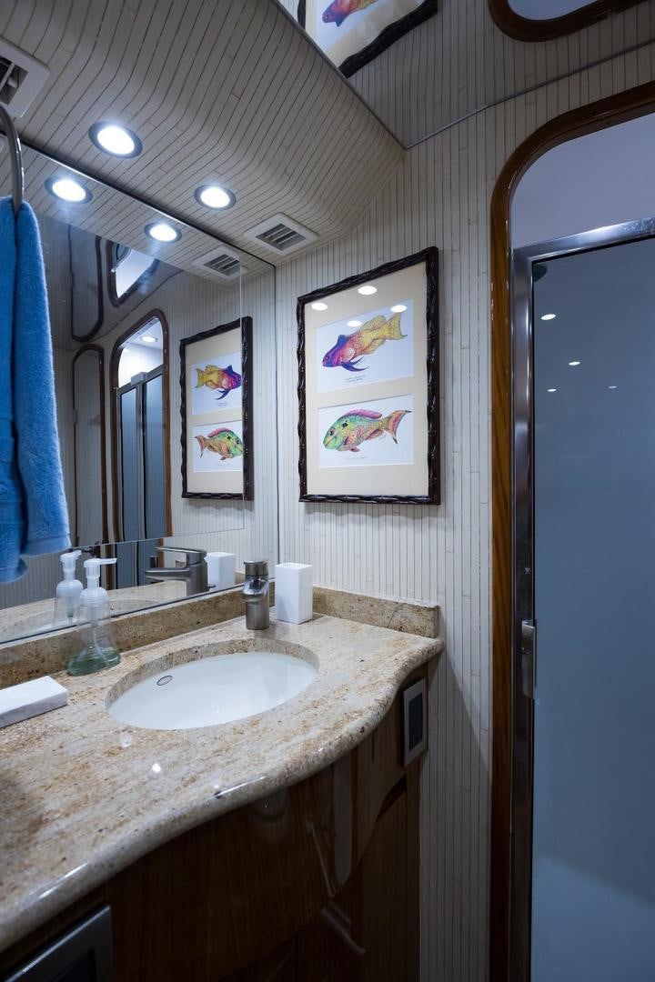 a bathroom with a sink and mirror aboard NO NAME 82 Yacht for Sale